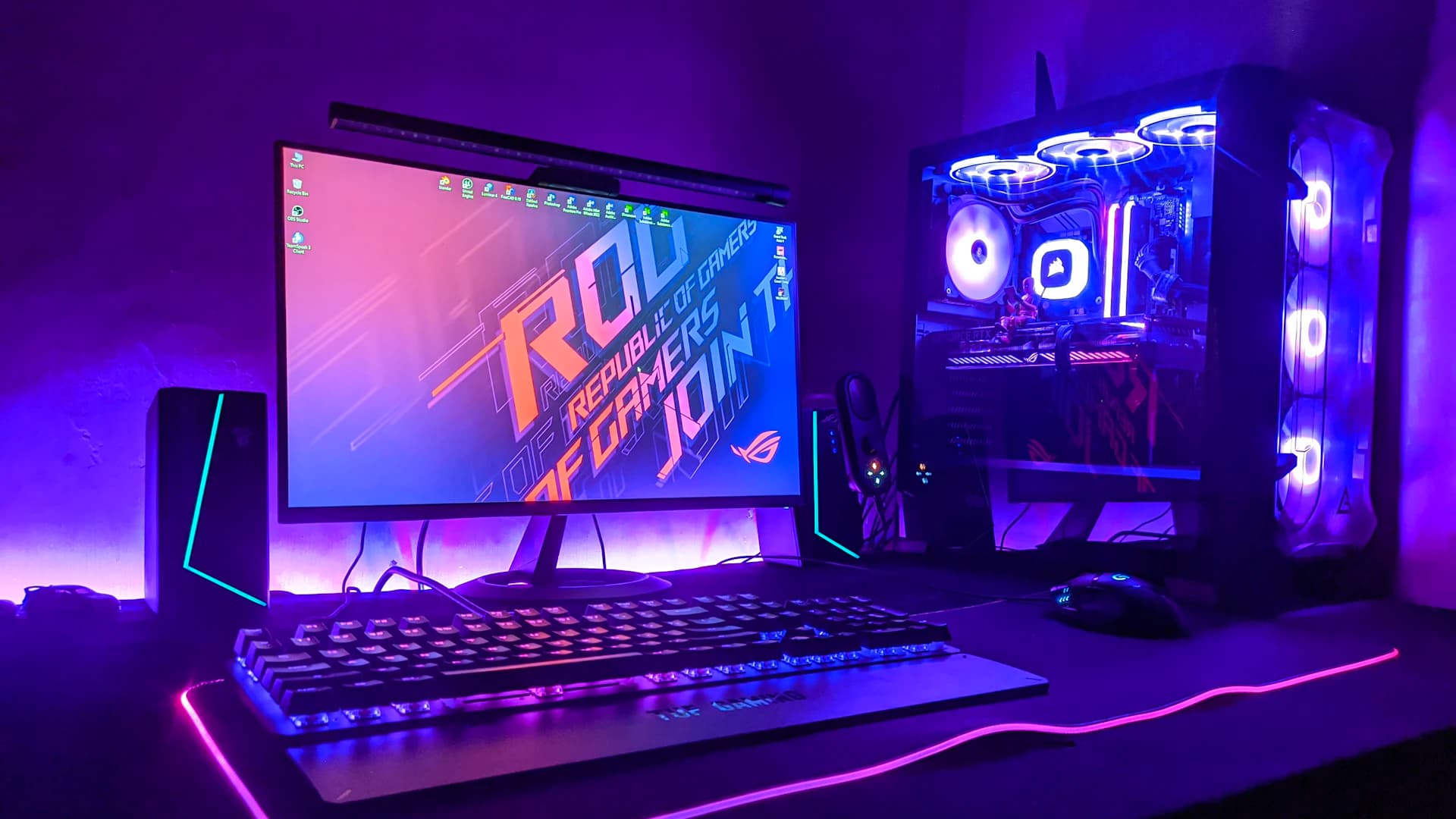 A desktop gaming PC lit in purple